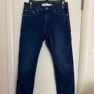 Men’s signature Levi Strauss&Co dark blue jeans.